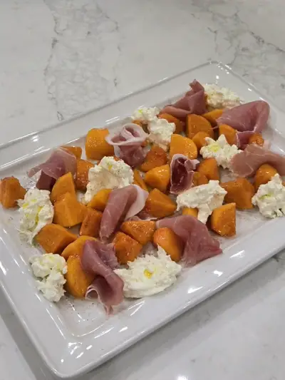 Prosciutto, persimmon and burrata platter with seasonal garnishes by Nashville Chef Mollie